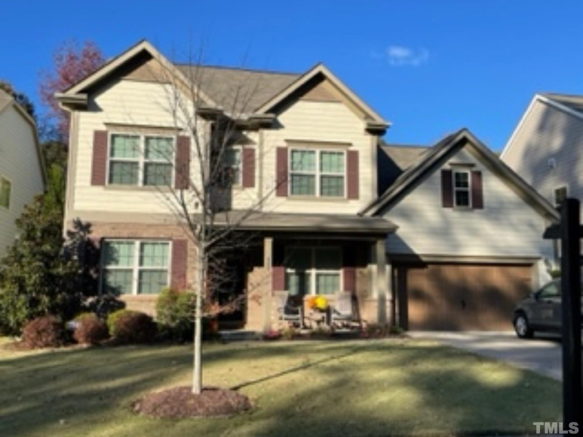 842 Wickham Ridge Road Apex, NC 27539 - Photo 42 of 43 a front view of a house with a yard