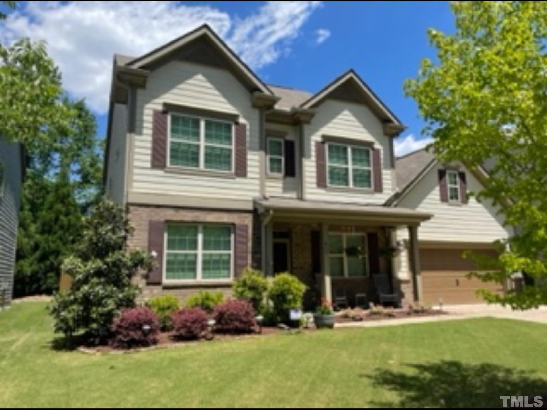 842 Wickham Ridge Road Apex, NC 27539 - Photo 43 of 43 front view of a house with a yard