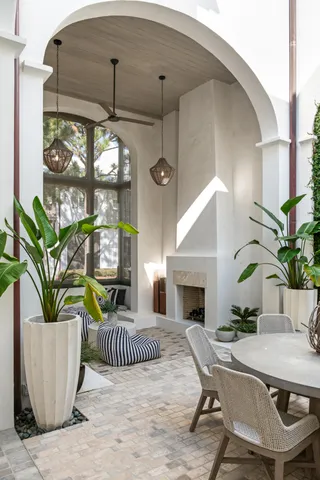 a living room with furniture a window and a fireplace