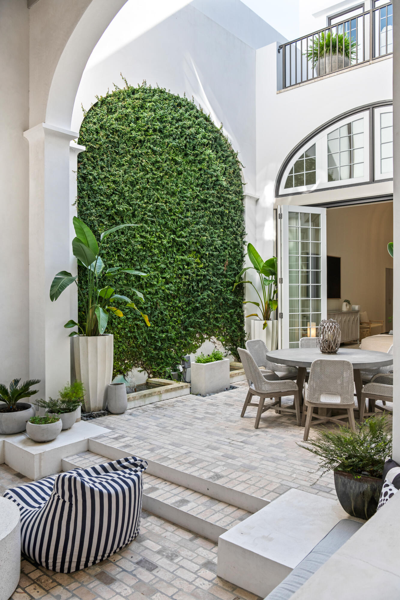 31 Sugar Loaf Alley Inlet Beach, FL 32461 - Photo 13 of 58 a view of a patio with couches table and chairs and potted plants