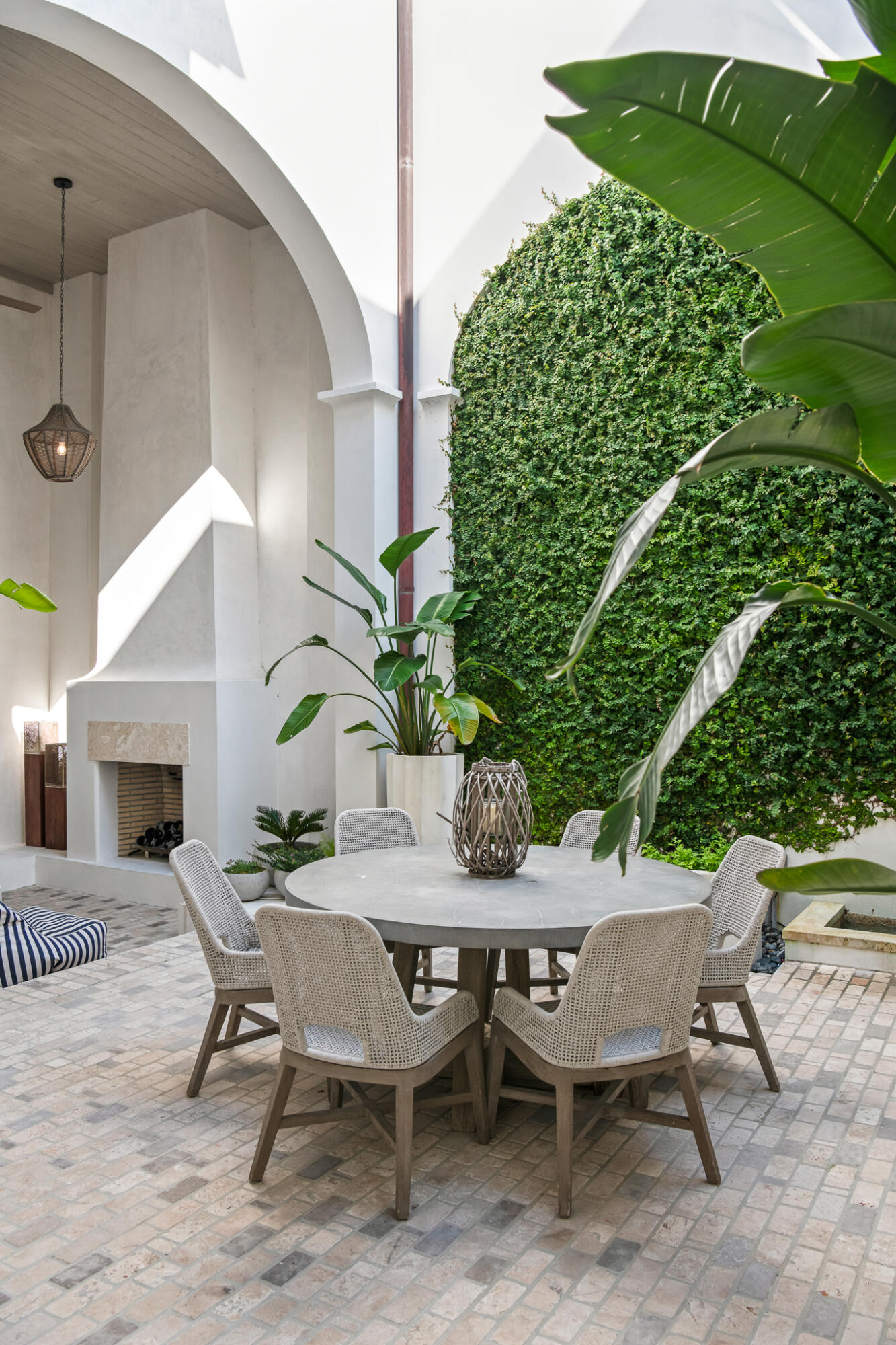 31 Sugar Loaf Alley Inlet Beach, FL 32461 - Photo 14 of 58 a view of a patio with table and chairs and potted plants