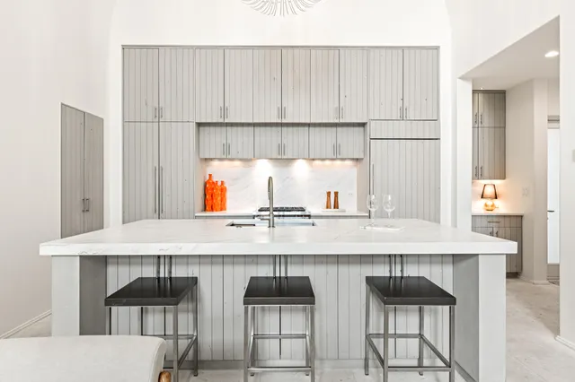 a kitchen with stainless steel appliances granite countertop a stove and a refrigerator