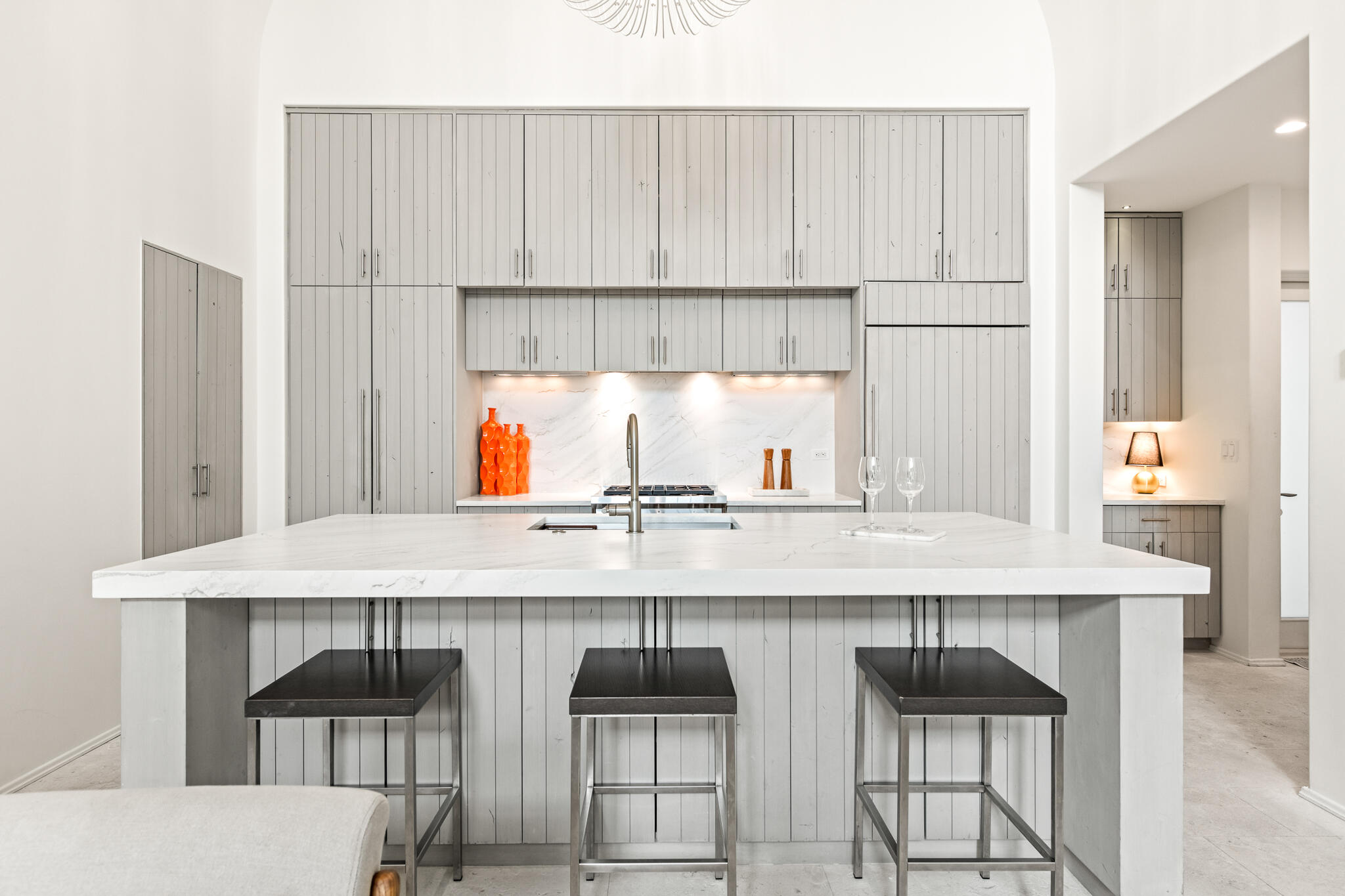 31 Sugar Loaf Alley Inlet Beach, FL 32461 - Photo 24 of 58 a kitchen with a kitchen island white cabinetry and chairs