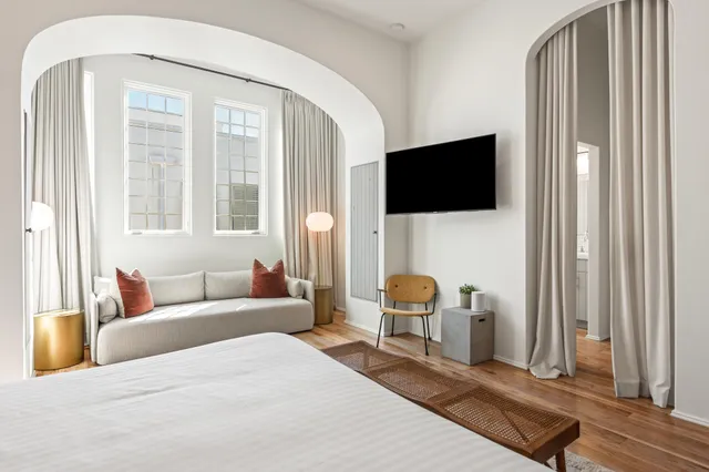 a bathroom with a double vanity sink and a window