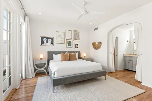 a living room with furniture and a mirror