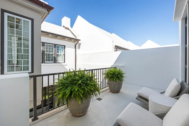 a view of a balcony with plants