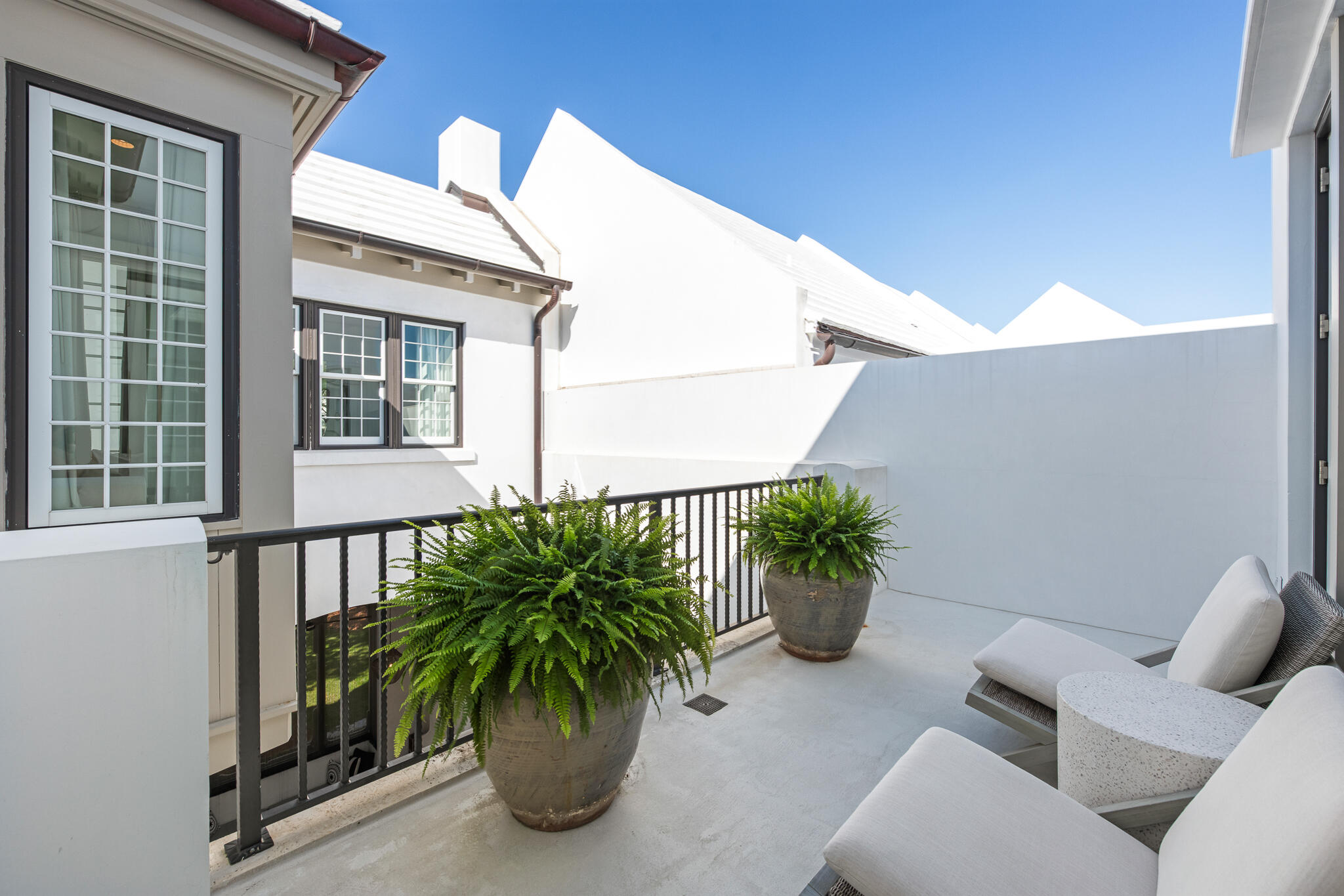 31 Sugar Loaf Alley Inlet Beach, FL 32461 - Photo 35 of 58 a potted plant sitting in front of a house