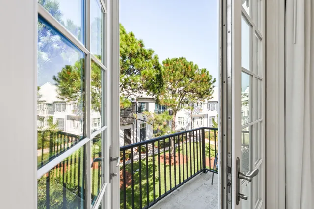 a kitchen with a stove and white cabinets