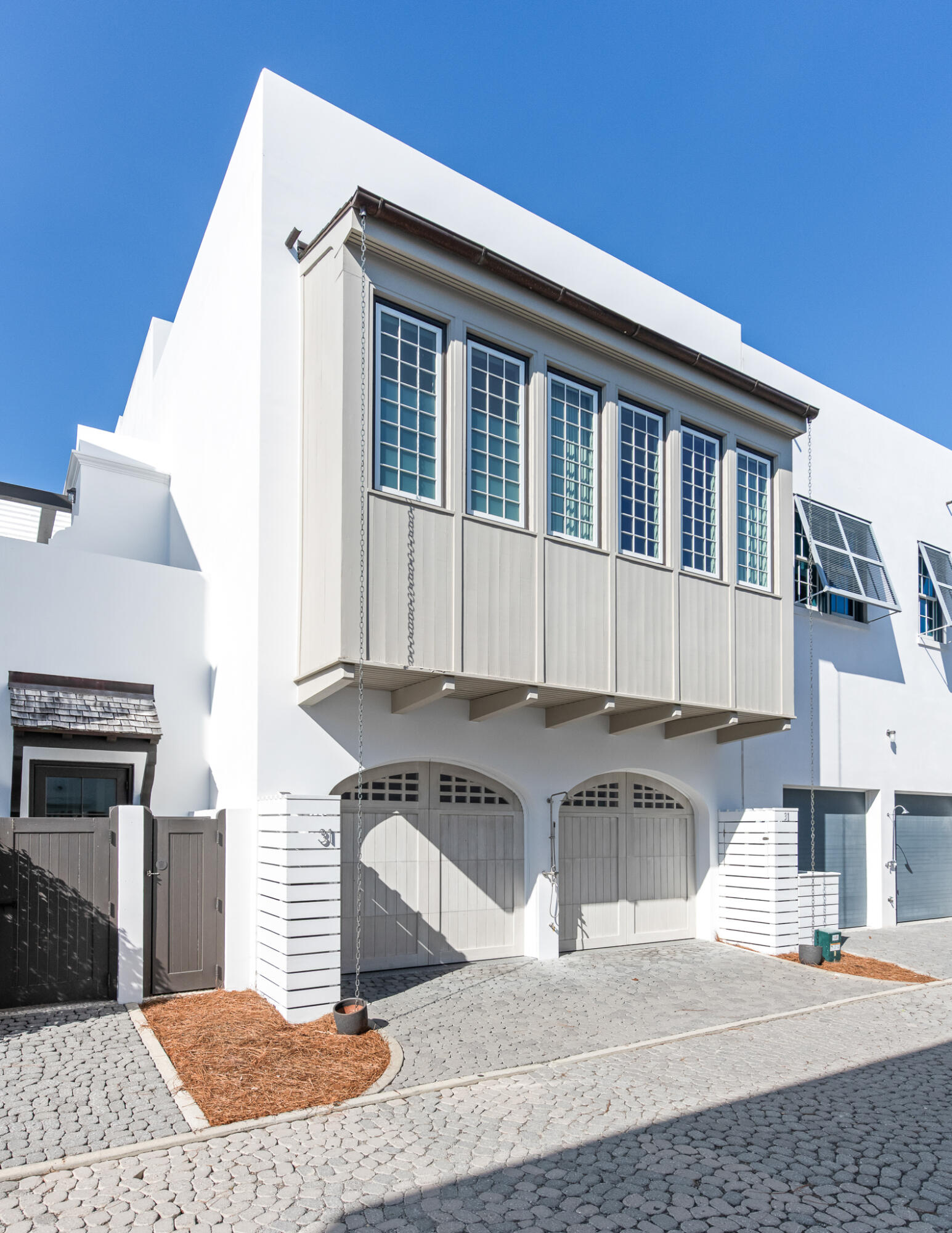 31 Sugar Loaf Alley Inlet Beach, FL 32461 - Photo 48 of 58 a kitchen with a stove and white cabinets