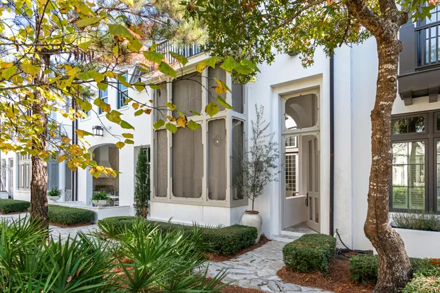 a front view of a house with a small yard