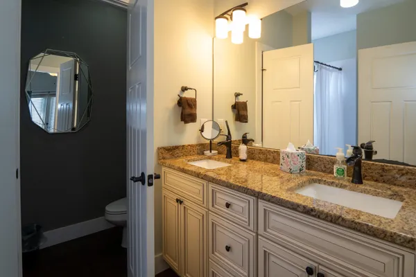 a dining room with furniture and a flat screen tv