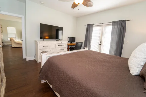 a front view of a house with a garden and yard