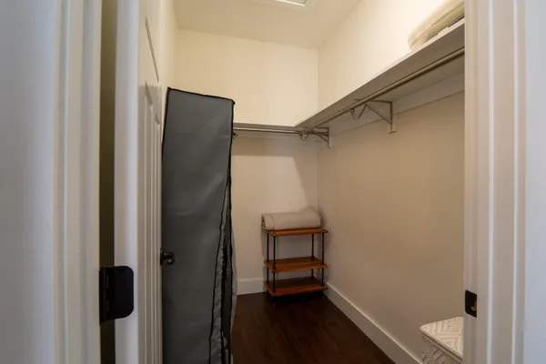 a bedroom with a bunk bed and a window