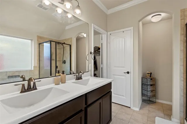 a bathroom with a sink double vanity and a mirror