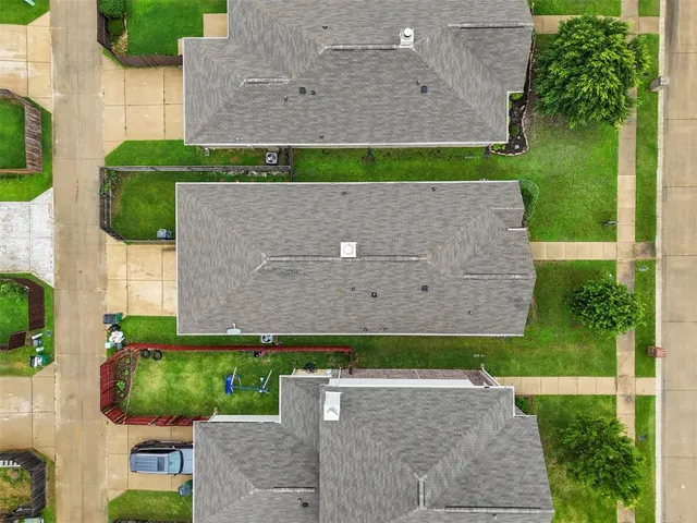 an aerial view of a house with a garden