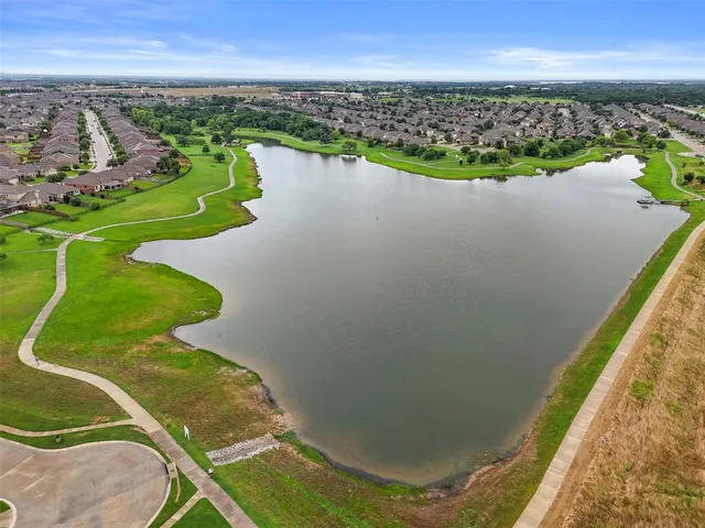 a view of a lake with a city