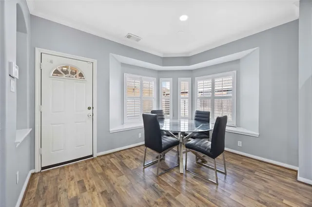 a view of a livingroom with furniture and wooden floor