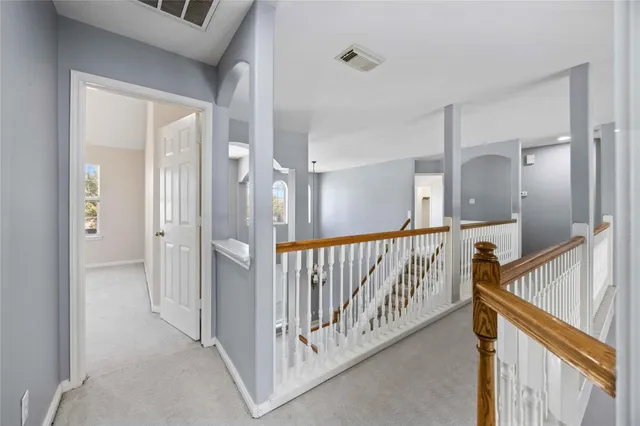 a view of a hallway with staircase