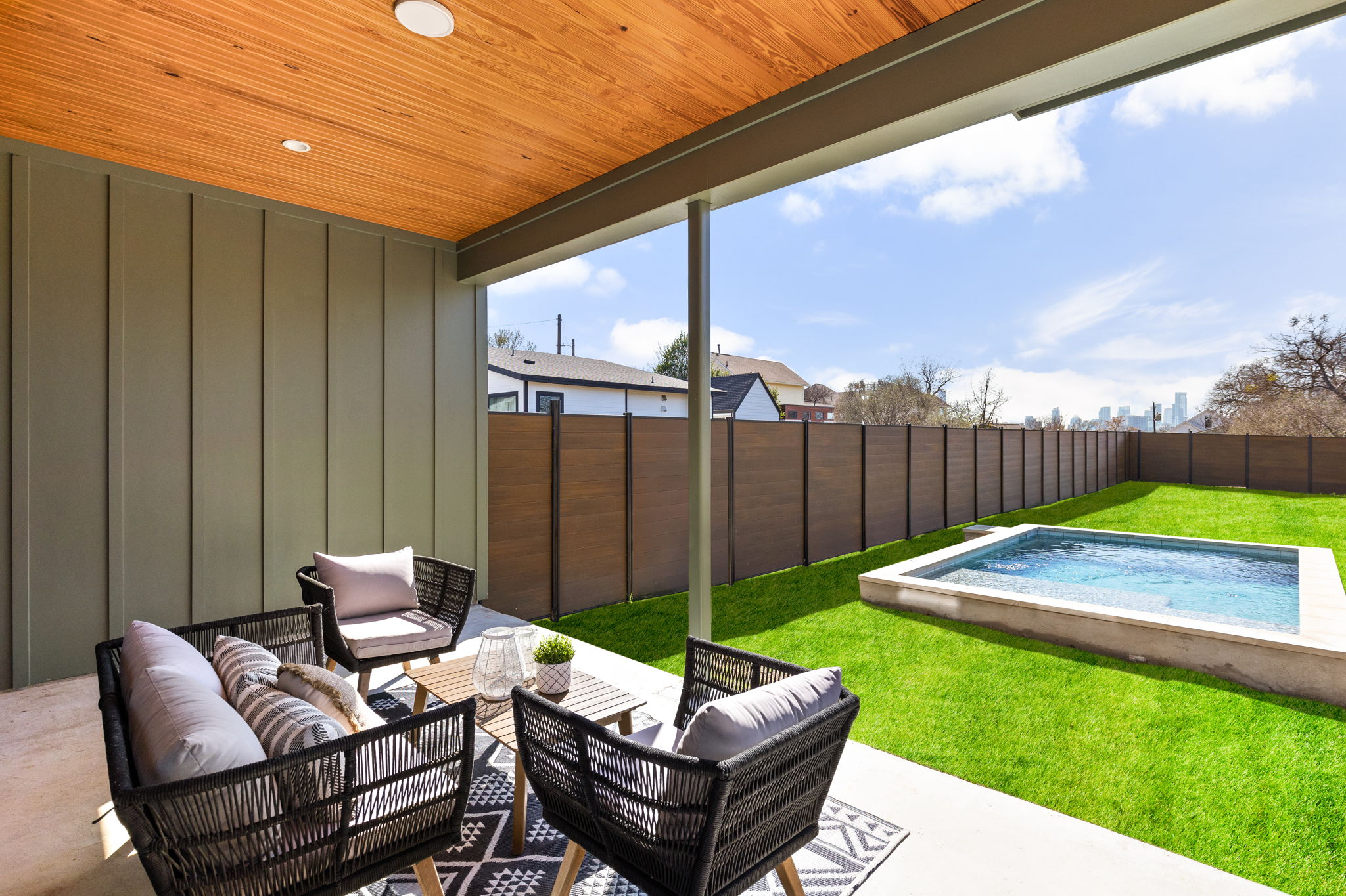 1610 Harvey Street, Unit 1 Austin, TX 78702 - Photo 34 of 39 Fenced backyard featuring a patio area, an outdoor hangout area, and a swimming pool
