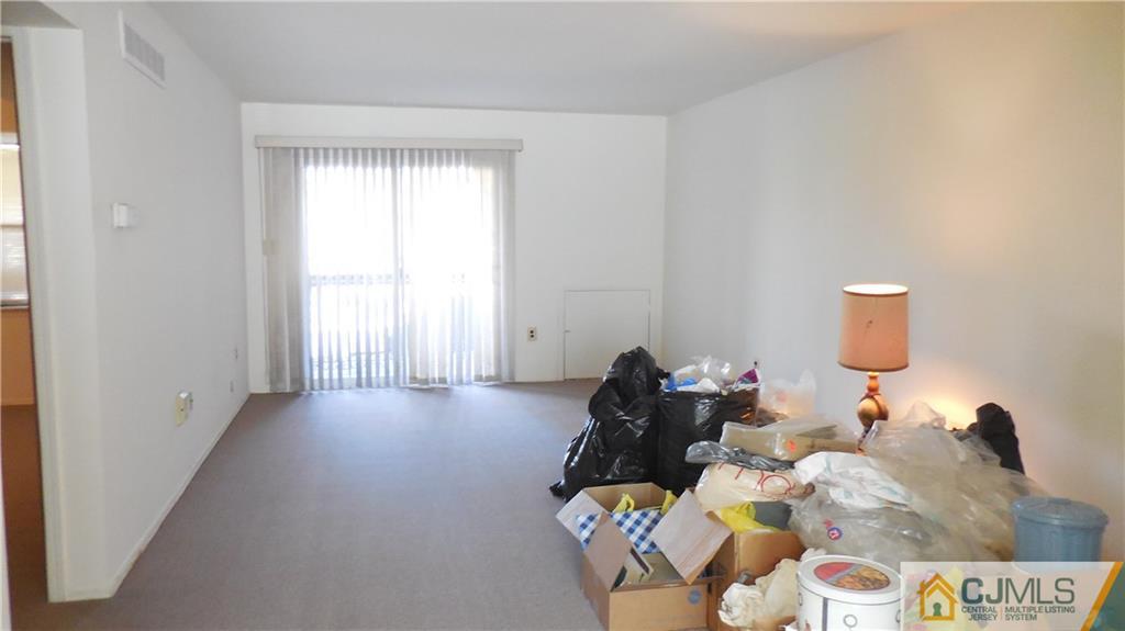 1913 Raspberry Court Edison, NJ 08817 - Photo 14 of 16 a living room with furniture and a window