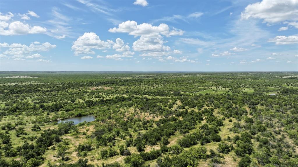 2850 County Road 122 Moran, TX 76464 - Photo 6 of 13 an aerial view of a houses with yard and mountain view in back