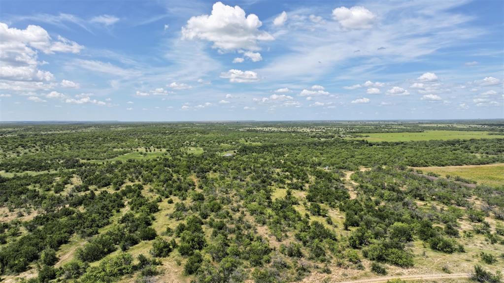 2850 County Road 122 Moran, TX 76464 - Photo 7 of 13 a view of a yard with an outdoor and seating area