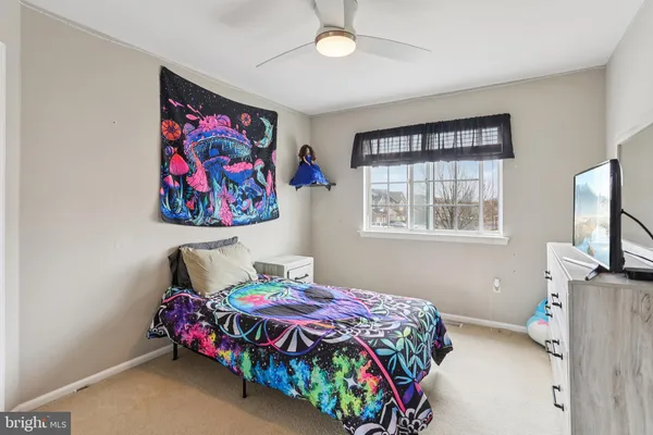 a bedroom with bed and a window