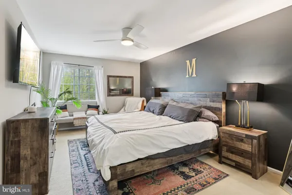 a bed room with a bed and a night stand
