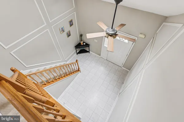 a view of an entryway with a ceiling fan