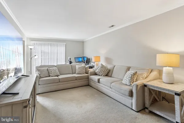 a living room with furniture and a couch