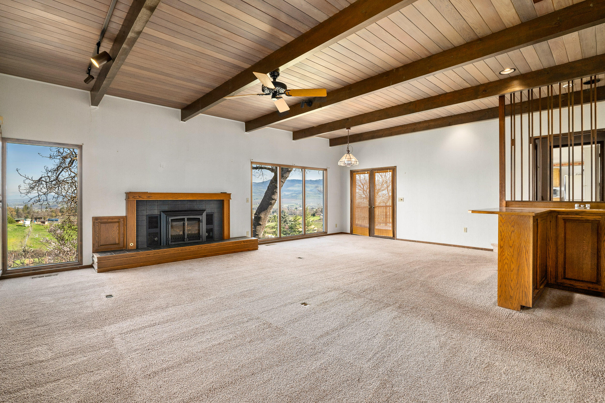 1000 Morey Road Talent, OR 97540 - Photo 24 of 48 a view of an empty room with a fireplace and a window