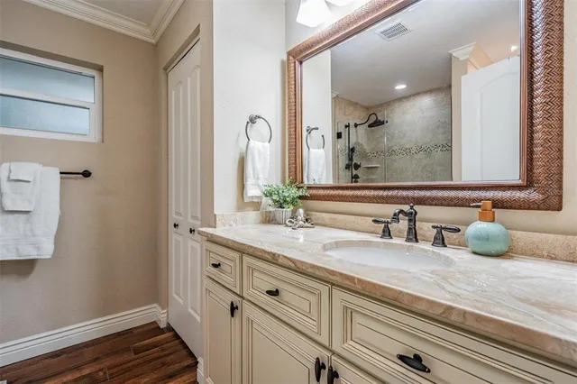 a bathroom with a sink and a mirror