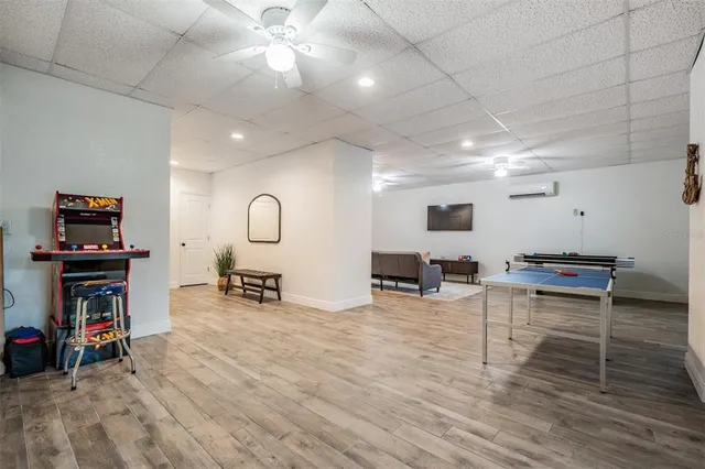 a view of a livingroom with furniture and a flat screen tv