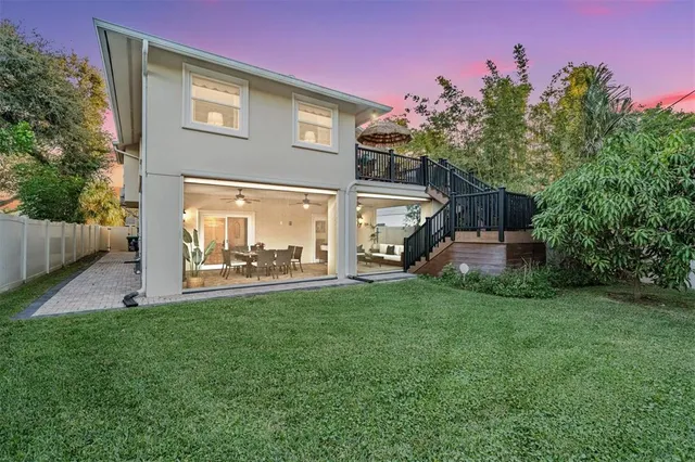 a view of a house with backyard and a slide