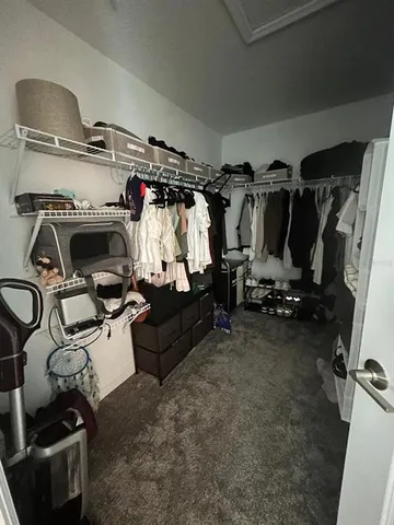 a bedroom with a bed gym equipment and a window