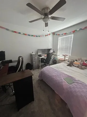 a bathroom with a double vanity sink and toilet