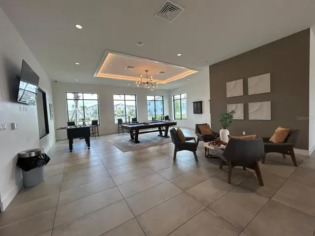 a view of palm trees and swimming pool in the patio