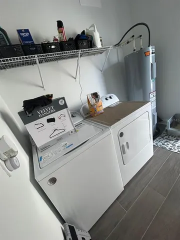a utility room with dryer and washer