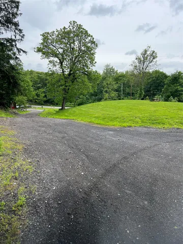 a view of a house with a big yard