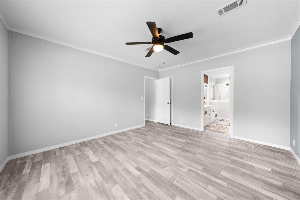 109 3900th Road Gilmer, TX 75644 - Photo 21 of 35 a view of empty room with wooden floor and ceiling fan