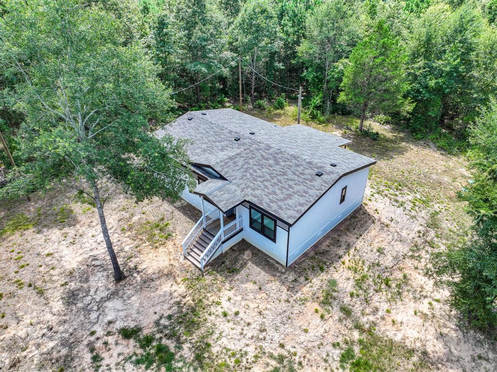 109 3900th Road Gilmer, TX 75644 - Photo 29 of 35 an aerial view of a house with yard and balcony
