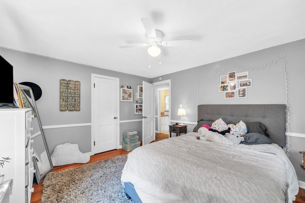 60 Westbrook Drive Springfield, MA 01129 - Photo 14 of 39 a bedroom with a bed and a chandelier