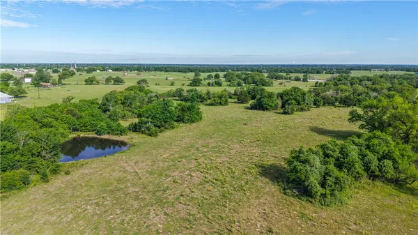 a view of a lake with a yard