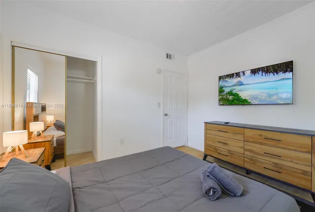 a bedroom with a bed and furniture