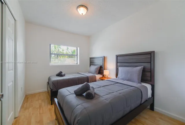 a bedroom with a bed and window