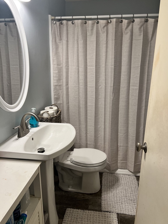 37 Ashmore Road Worcester, MA 01602 - Photo 4 of 5 a bathroom with a sink toilet and a mirror