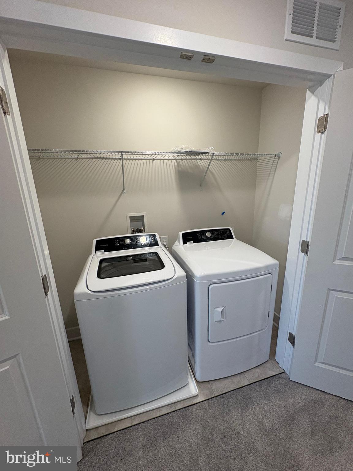 1744 Water Xing Road Baltimore, MD 21208 - Photo 10 of 12 a utility room with dryer and washer