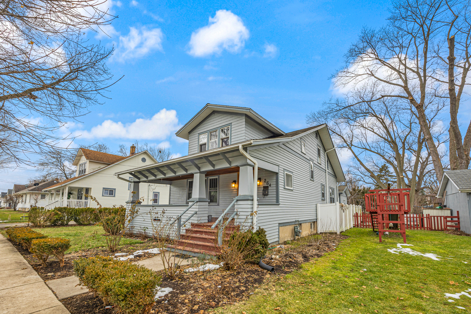 254 Moseley Street Elgin, IL 60123 - Photo 1 of 1 a front view of a house with a yard