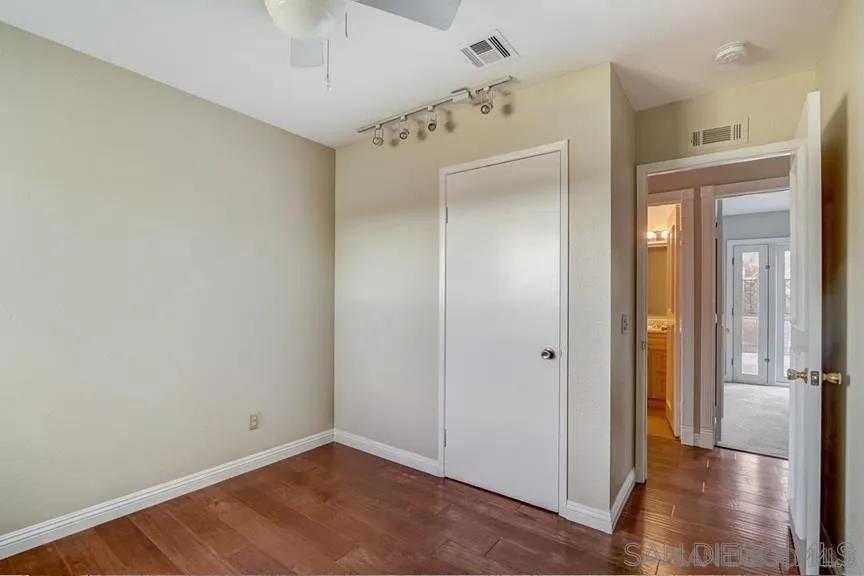 14550 Dehia Street Poway, CA 92064 - Photo 13 of 15 a view of a hallway with wooden floor