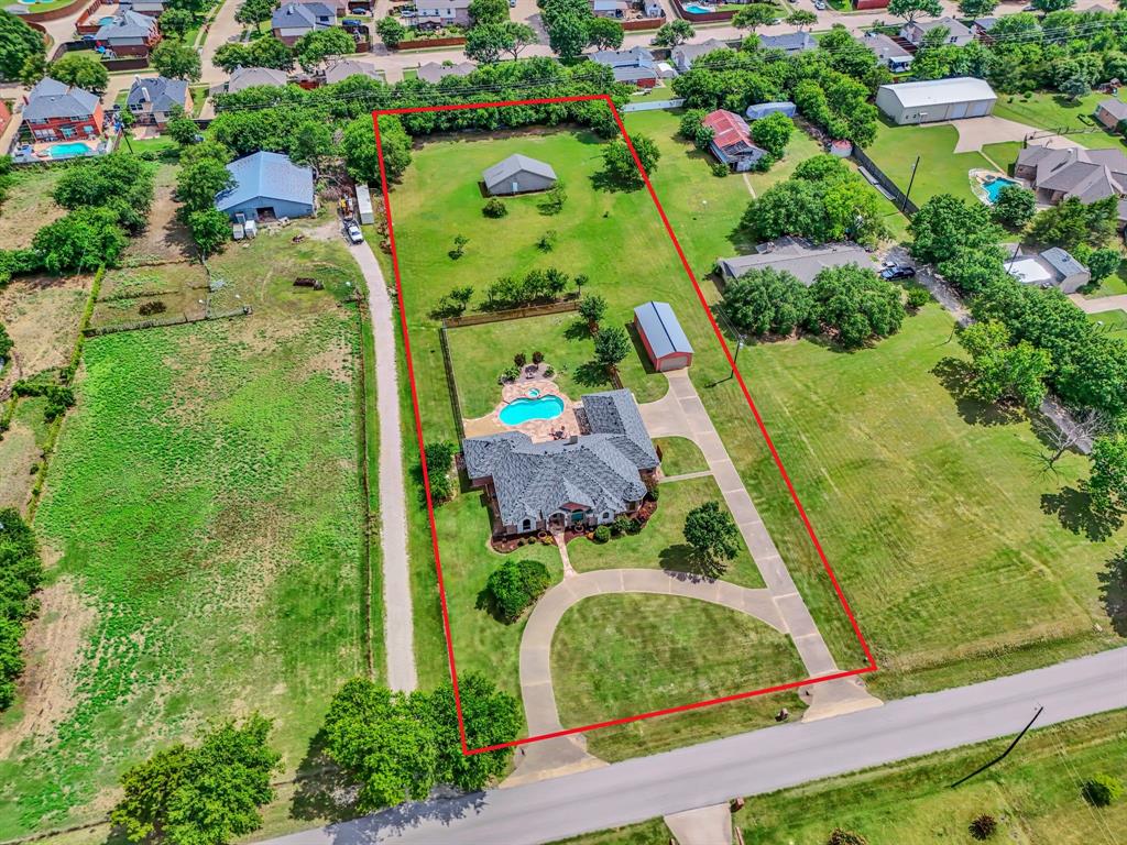 50 Buckingham Lane Allen, TX 75002 - Photo 7 of 39 Aerial perspective of suburban area with property parcel outlined and a pool area
